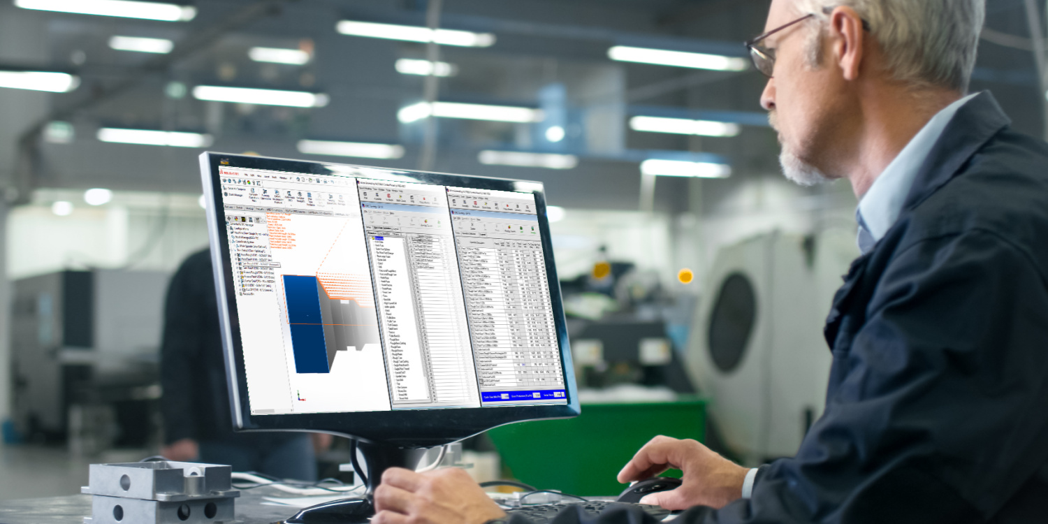 An engineer working on an activity-based estimate on a computer on the shop floor.